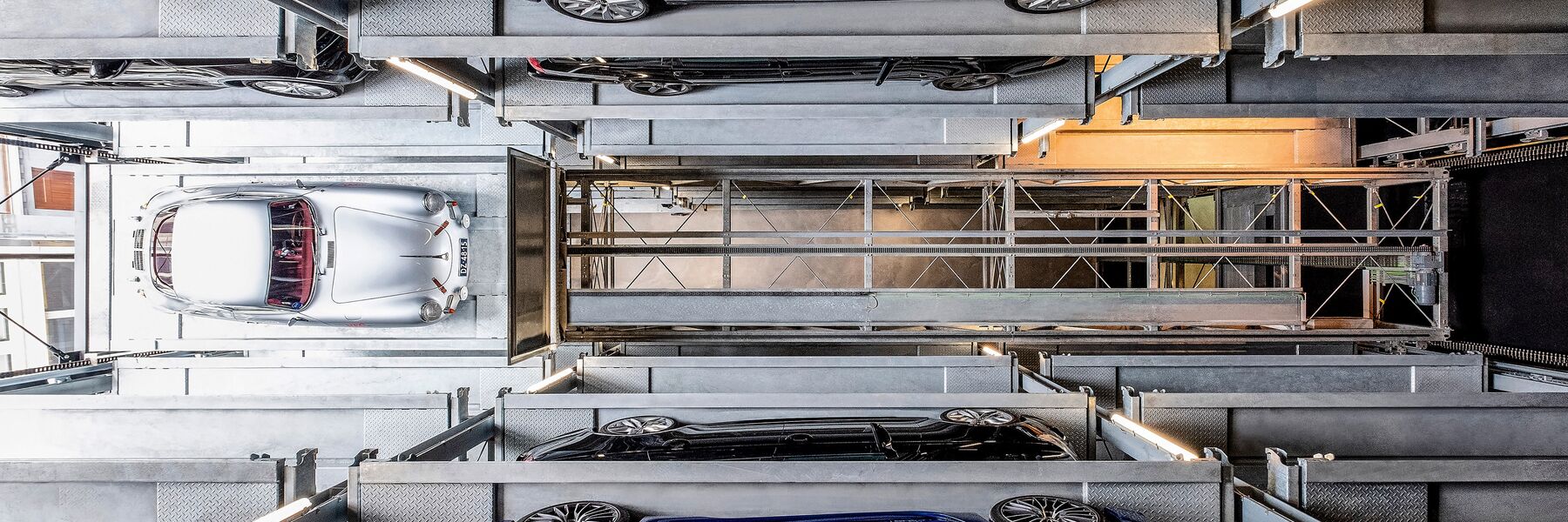 Interior view of the parking system with a sports car parked inside