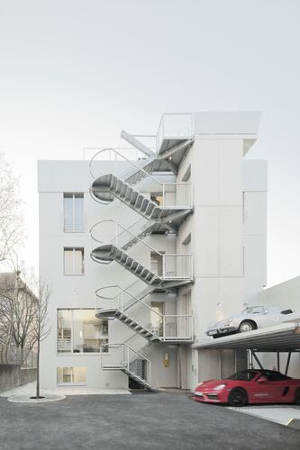 A building on Olgastraße with a car parking system built in front of it
